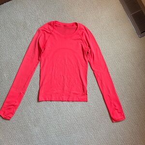 Lululemon Swiftly Tech 2.0. Race length. Size 2. Color: bright orange